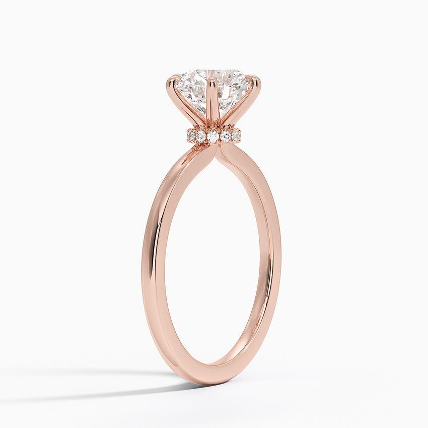 Förlovningsring i roséguld med dolt halo