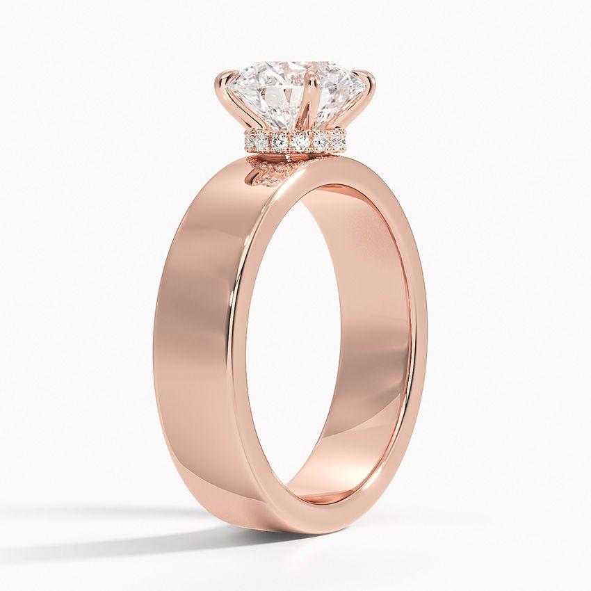 Förlovningsring i roséguld med dolt halo